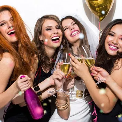 Group of women toasting the bride to be.